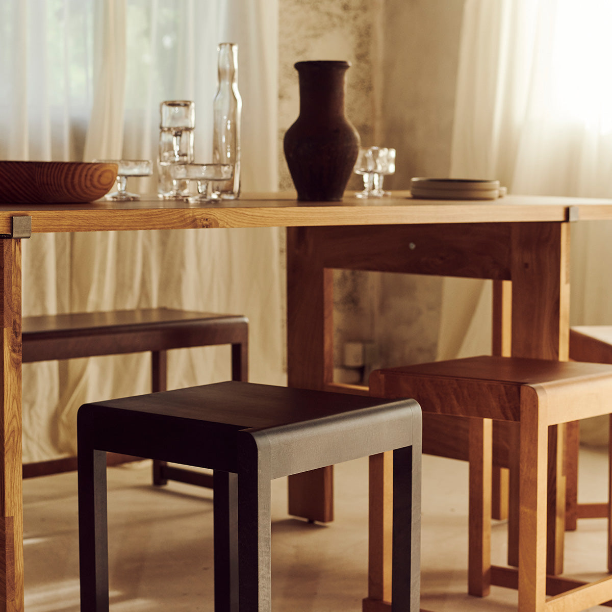 Frama low stool 01 with a table setting