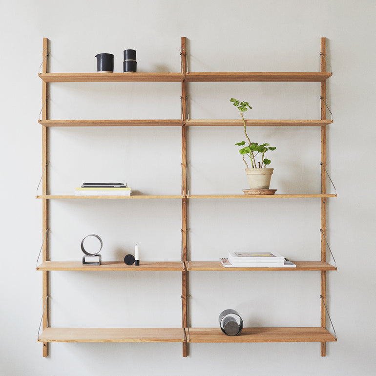Frama Shelf Library double section natural oak with cups, plants and books stored