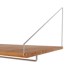 Frama Shelf Library wall-mounted shelving unit with metal brackets and adjustable shelves.