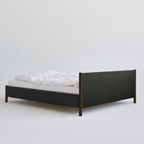 Minimalist wooden bed frame designed by Rye Sleep and available at By Mölle. Featuring clean Scandinavian lines, a low-profile form, and a softly upholstered headboard, this bed blends timeless design with natural materials for a calm, modern bedroom atmosphere