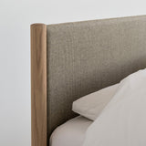 Minimalist wooden bed frame designed by Rye Sleep and available at By Mölle. Featuring clean Scandinavian lines, a low-profile form, and a softly upholstered headboard, this bed blends timeless design with natural materials for a calm, modern bedroom atmosphere