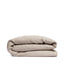 By Mölle's Clay linen duvet cover, crafted from 100% pre-washed European flax linen, features a light earthy shade achieved through chambray weaving. This breathable and hypoallergenic fabric offers comfort year-round and is available with either wooden buttons or a tuck-in flap closure.