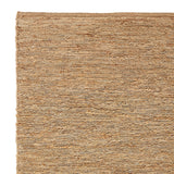 Detail van handgeweven jutevezels in het River vloerkleed – milieuvriendelijk design