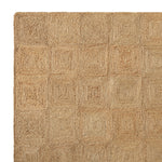 Detail van de handgecoilde jute structuur en gevlochten rand van het Sequoia vloerkleed