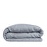By Mölle's Cloudy Blue linen duvet cover, crafted from 100% pre-washed European flax linen, features a chambray weave combining faded blue and off-white yarns. This breathable and hypoallergenic fabric offers comfort year-round and is available with either wooden buttons or a tuck-in flap closure. Handmade in the Netherlands with respect for the earth.