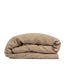 By Mölle's Hazel linen duvet cover, crafted from 100% pre-washed European flax linen. This warm, earthy tone adds a natural touch to your bedroom. The duvet cover is available with either wooden buttons or a tuck-in flap closure, combining functionality with timeless design.