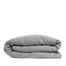 By Mölle's Pebble linen duvet cover, crafted from 100% pre-washed European flax linen, features a soft, contemporary grey shade achieved through chambray weaving with grey and off-white yarns. This breathable and hypoallergenic fabric offers comfort year-round and is available with either wooden buttons or a full-width tuck-in flap closure. Handmade in the Netherlands with respect for the earth.