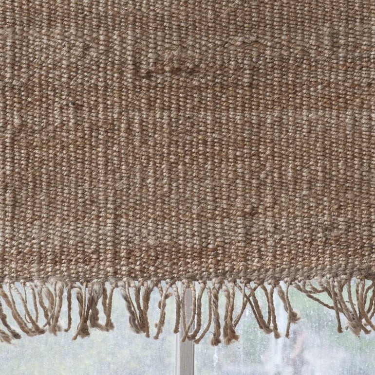 Handwoven hemp rug By Mölle with fringes.
